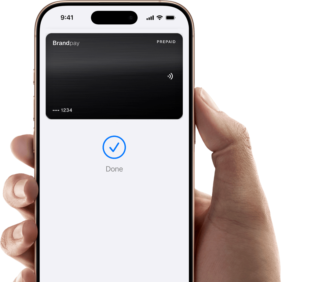 An iPhone held in a hand, showing the BrandPay card added to Apple Wallet with a Done confirmation
